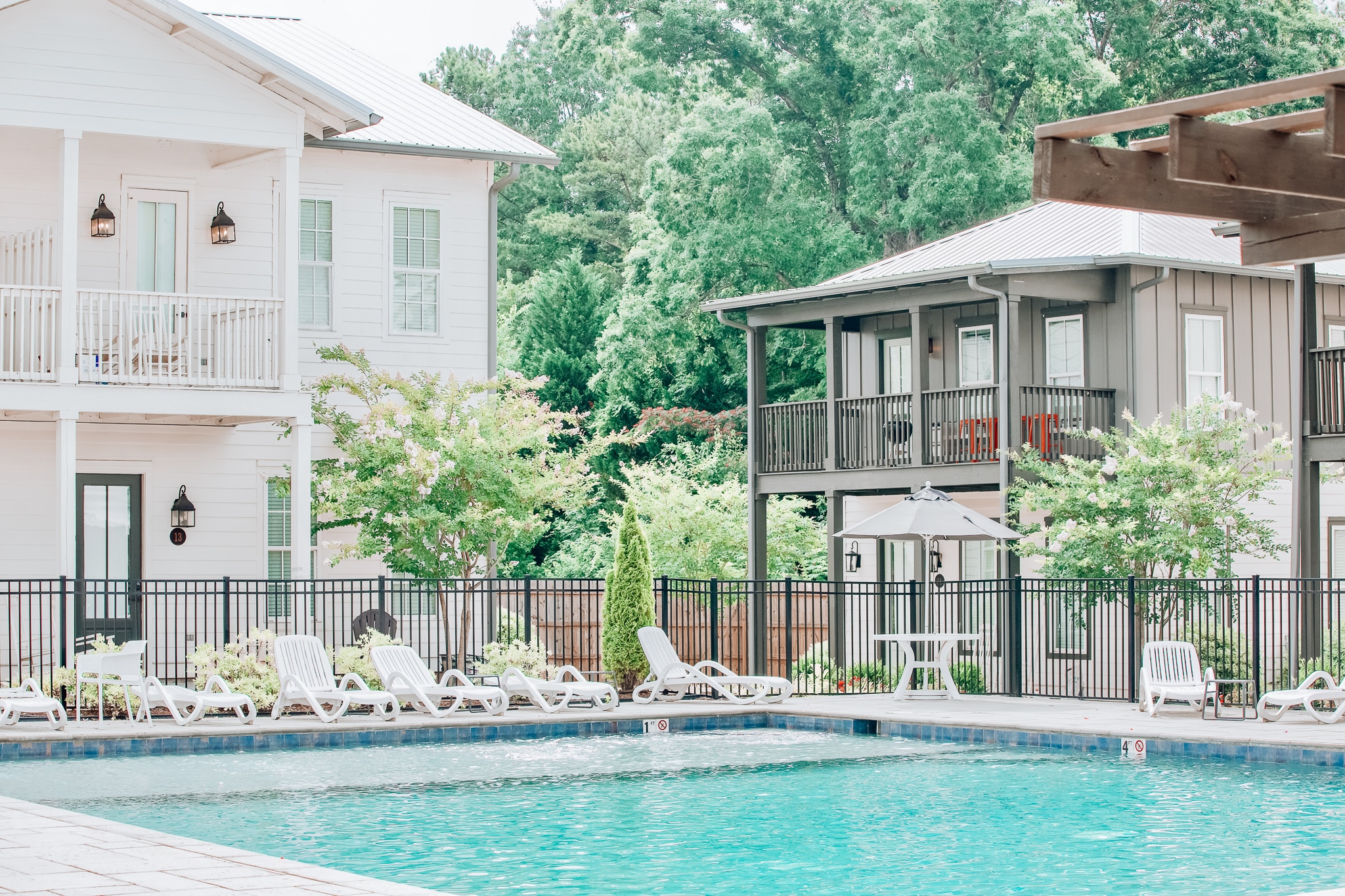 A beautiful resort-style pool outside of two luxury buildings at Midtown Auburn